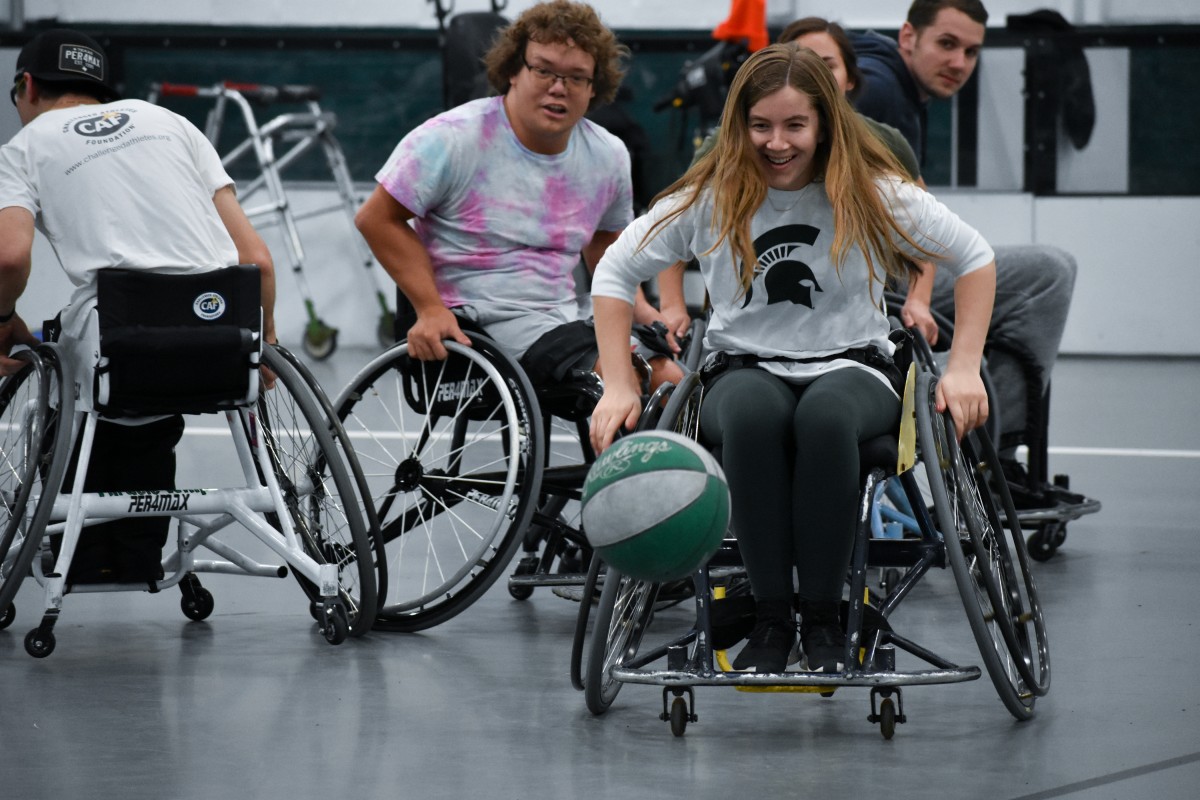 Students playing wheelchair basketball